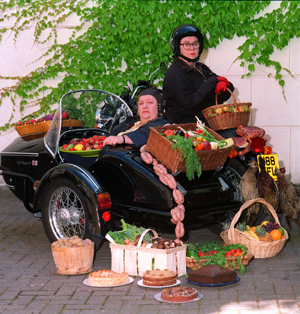 Two Fat Ladies with motorcycle and sidecar.