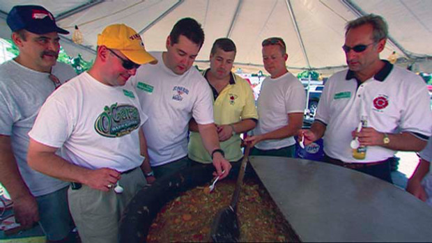 Undated handout photo of St. Paul cops and firefighters™ booya celebration, featured on PBS™ The Meaning of Food show on Friday. In St. Paul, Minnesota, the firefighters and police hold an annual all-male, all-night ritual to see who prepares the best Booya. Featured in "Food and Family".