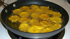 Tostones being fried for the second time