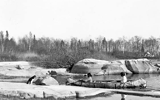 Indians in canoe on Lake of the Woods, ca. 1912.