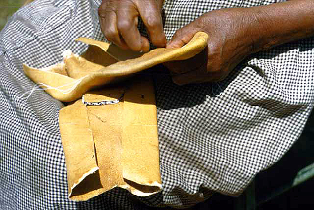 Mrs. George Stump Sewing Moccasins, Squaw Point, Leech Lake, 1948.