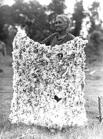 Mrs. John Franks and rabbit robe, White Earth Reservation, 1942