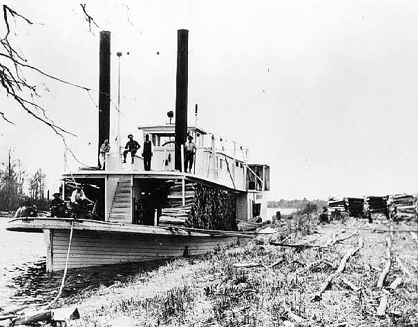 Loading logs on to steamer at Frank S. Lane Wood Yards, Cut Foot Sioux Lake, ca. 1916.