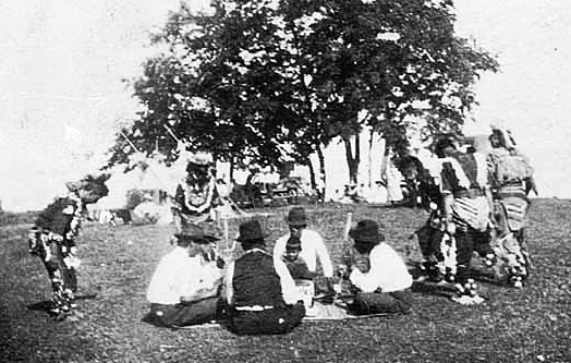 Indian singers and dancers at powwow, Mille Lacs Reservation, 1920