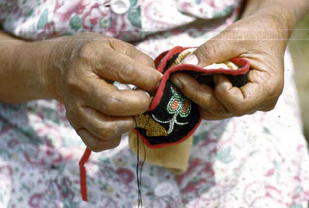 Mrs. Morgan Sewing Moccasin, Bena, 1948