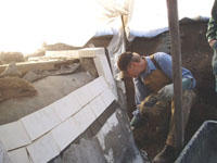 Pat  applying exterior insulation.