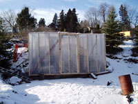 Temporary shelter erected over oven for the winter.