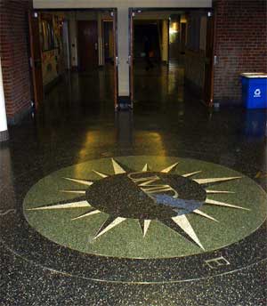 compass design in floor of hallway