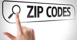 hand pointing at a searchbar containing the phrase zip codes