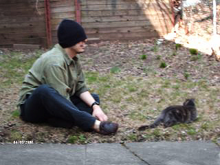 Gregory and Miss Mouse outdoors in 'conversation'