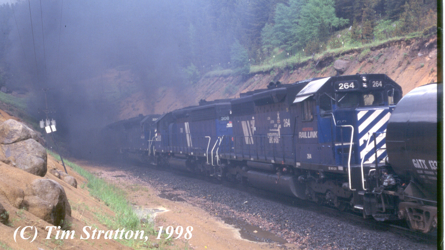 MRL mid-train helpers on westbound BNSF freight at Blossburg, MT